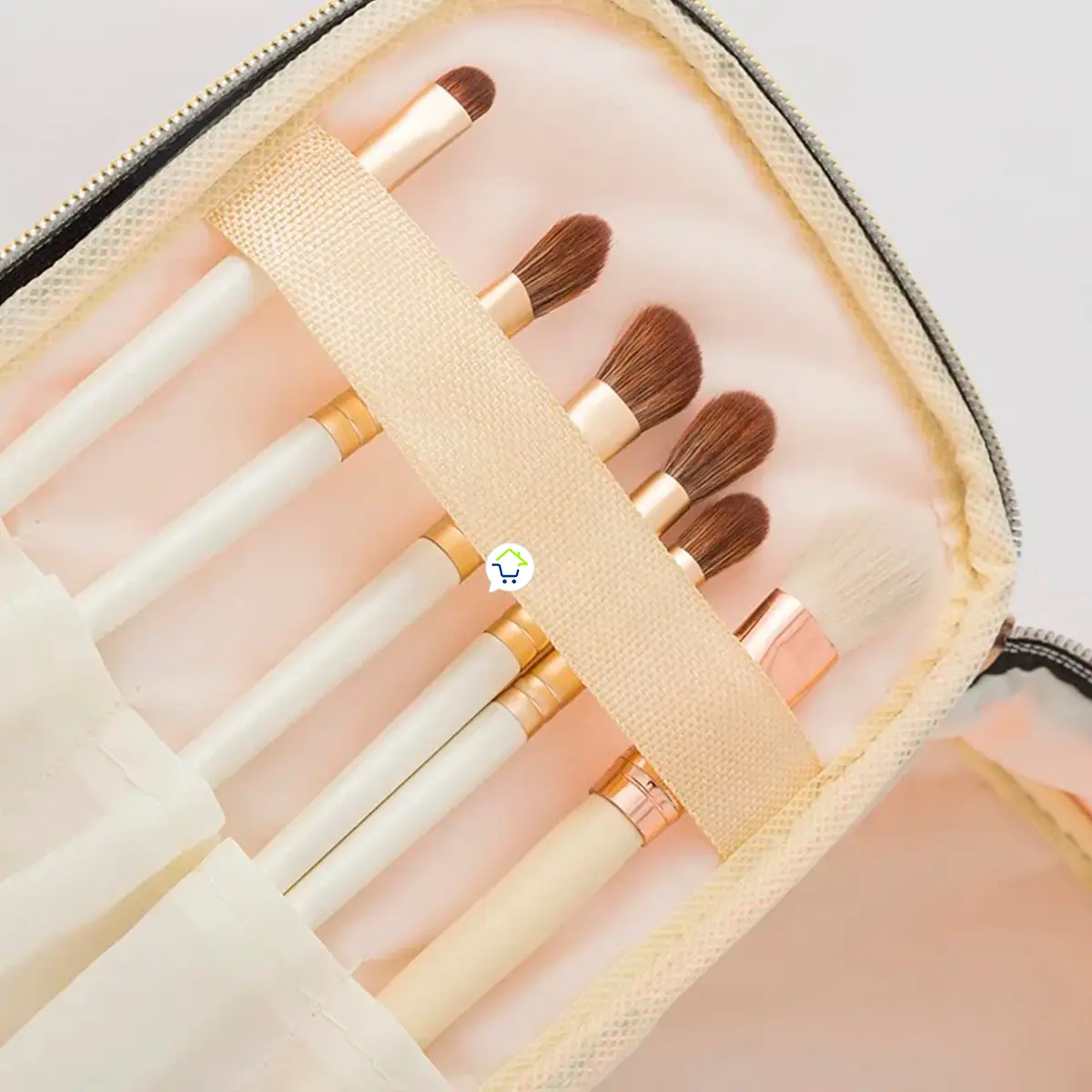 Neceser organizador de maquillaje con brochas, ideal para viajes.