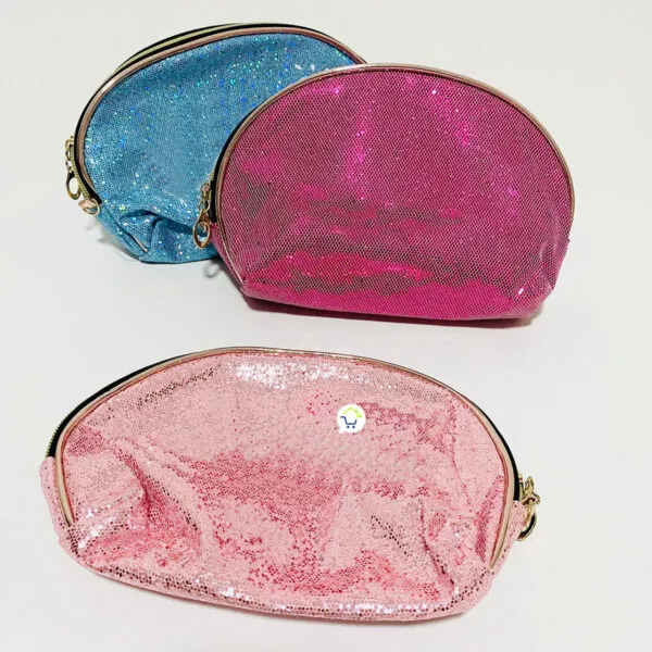 Neceser multiusos viajero con lentejuelas brillantes rosa, azul y fucsia.
