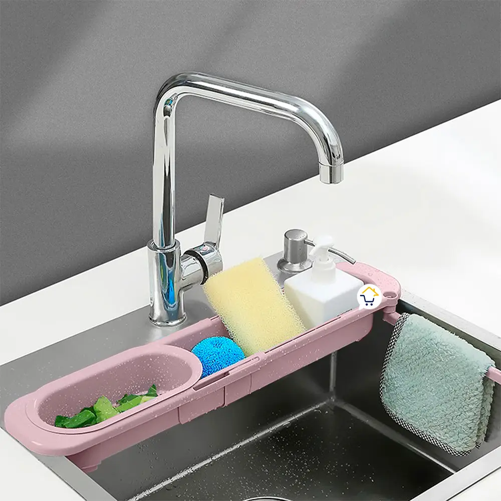 Escurridor plegable telescópico de cocina con esponja, jabón y toalla sobre el lavaplatos.