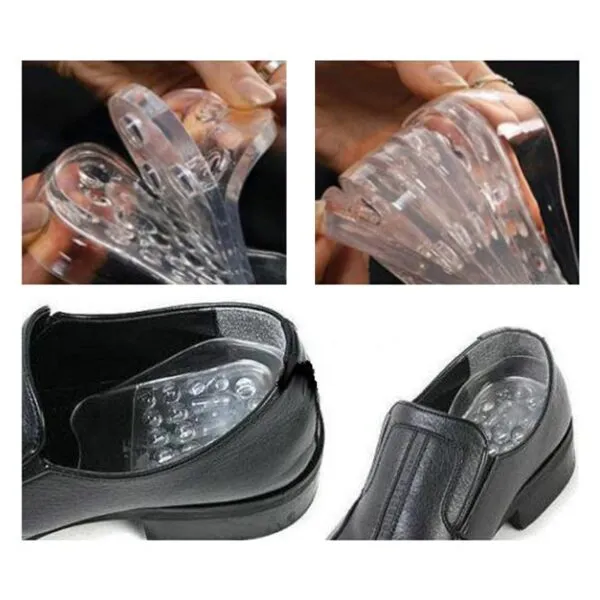 Plantillas de silicona ortopédicas para aumentar estatura hasta 5 cm, insertadas en zapatos de vestir negros.