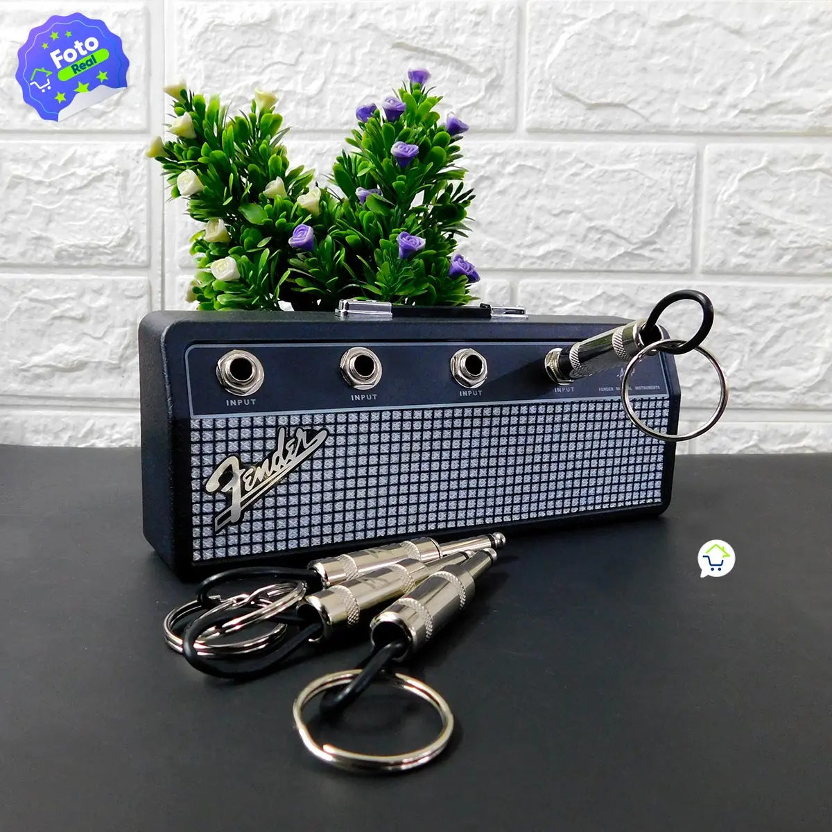 Llavero portallaves amplificador Fender con conectores, ideal para músicos.