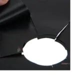 Set de 4 protectores reutilizables negros para estufa, con aberturas.