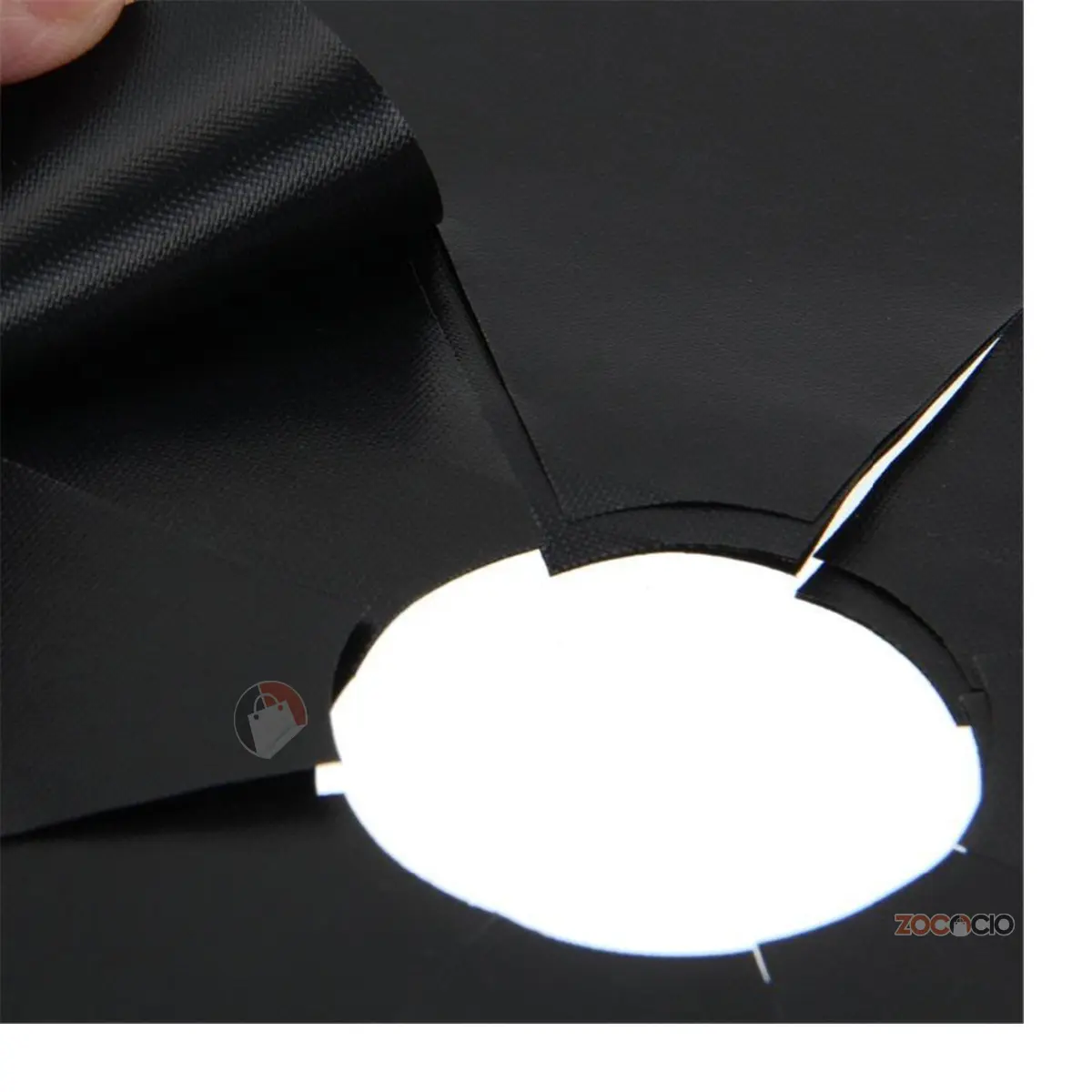 Set de 4 protectores reutilizables negros para estufa, con aberturas.