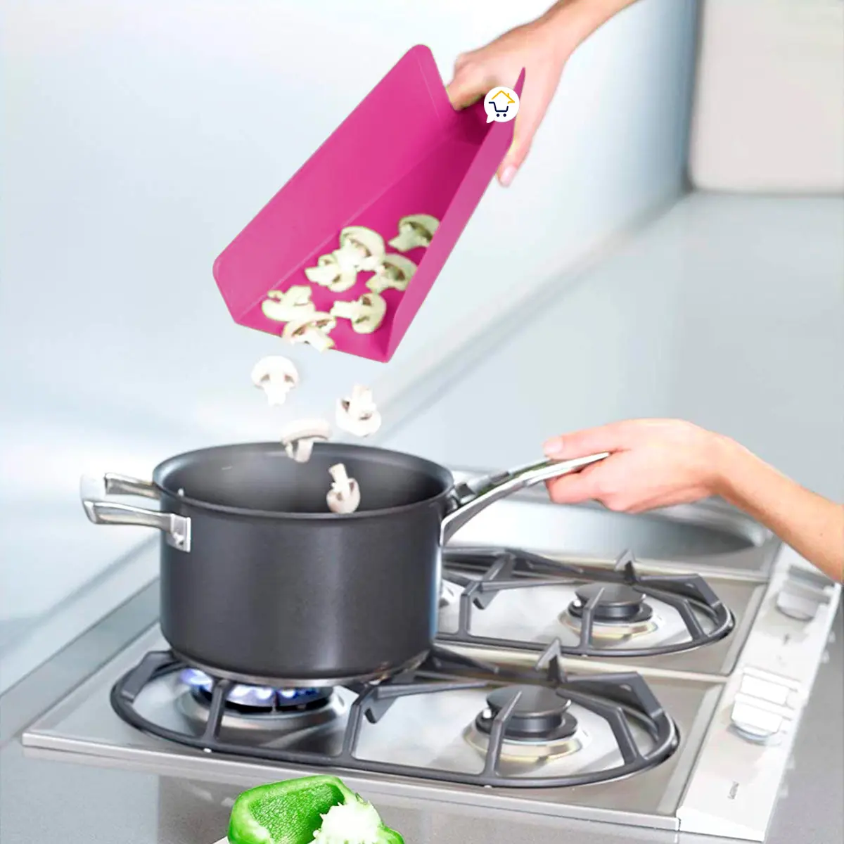 Tabla plegable antiadherente rosa con champiñones cayendo a una olla en estufa.