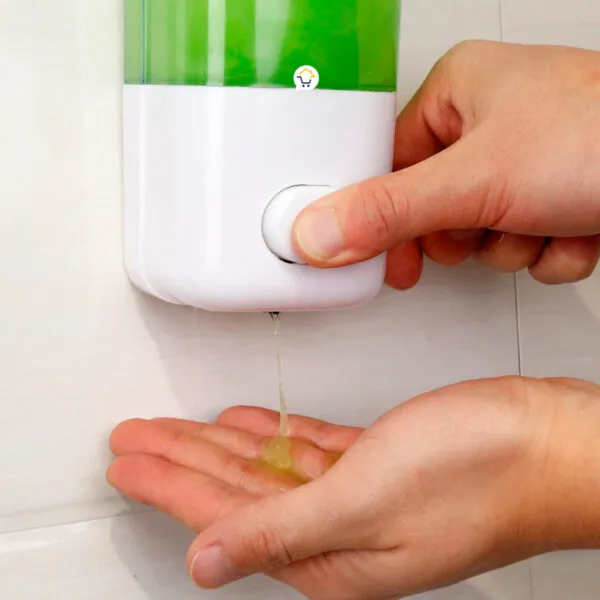 Dispensador de jabón dosificador antibacterial, vertiendo líquido en mano.