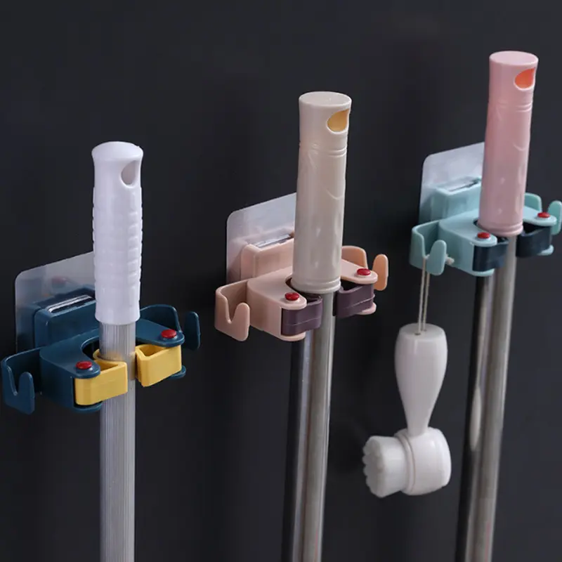 Soportes adhesivos para escobas y traperos, ganchos organizadores de pared resistentes.
