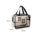 Bolso cosmetiquera transparente para viaje, 29x21x12 cm, con diseño grabado.