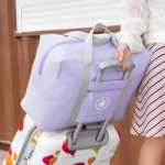 Maleta plegable de viaje impermeable, bolso de mano compacto y ligero violeta, apta para equipaje de mano.