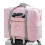 Maleta de viaje rosa impermeable, bolso de mano plegable y ligera con compartimento para equipaje.