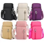 Mini bolso billetera porta celular manos libres para mujer, varios colores, con correa ajustable y dije de corazón.