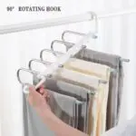Perchero 5 ganchos giratorio para pantalones, con diseño 90° que optimiza espacio.