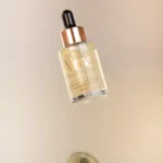 Tónico facial despigmentante e iluminador Alma con gotero, en envase de vidrio.