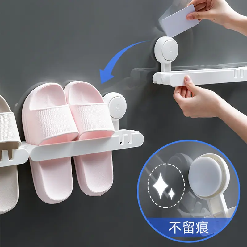 Organizador de zapatos adhesivo con estantes para zapatillas rosadas colgadas en la pared.