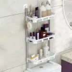 Organizador de baño de 3 niveles para inodoro, con botellas, perfumes, toallas de papel y cepillo.