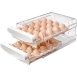 Contenedor de huevos apilable transparente con dos bandejas y múltiples huevos de color marrón claro.