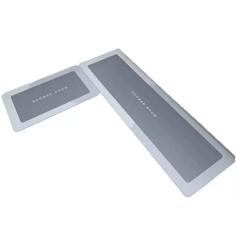 Kit x2 tapetes de cocina absorbentes y antideslizantes con texto "SHOWER ROOM", grises.