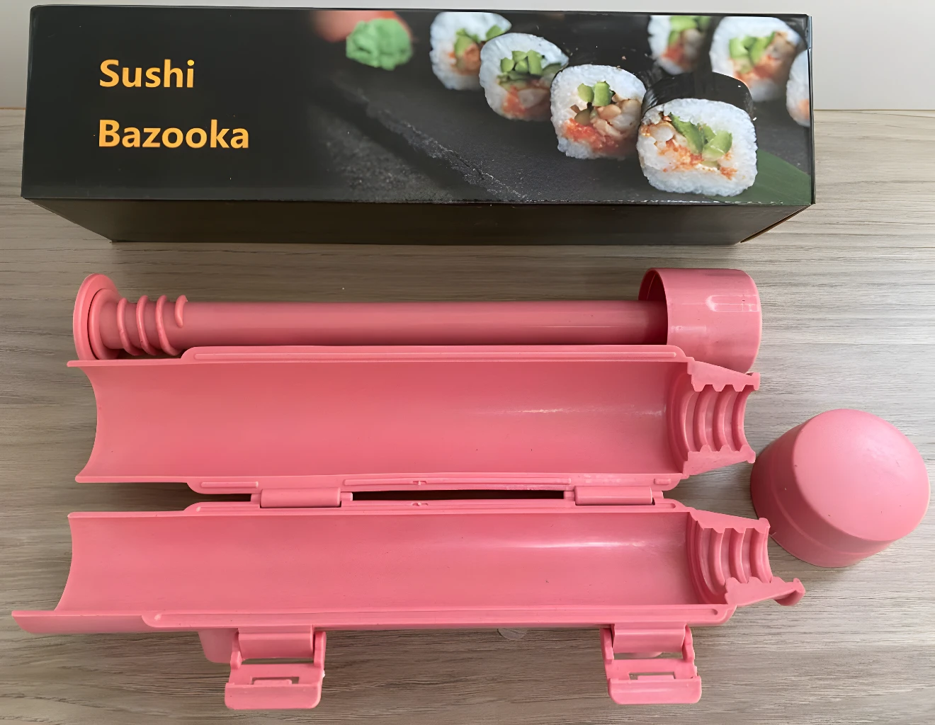 Máquina para hacer sushi tipo bazuca, ideal para enrollar rollos perfectos.