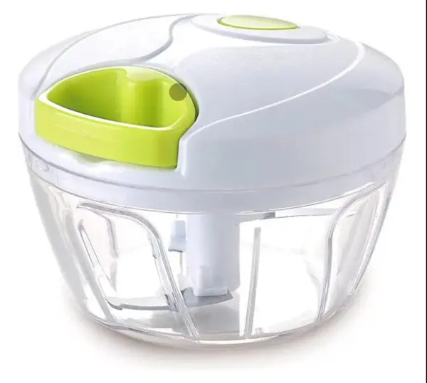 Picador de alimentos manual con tapa blanca y verde, cuerpo transparente y cuchillas.