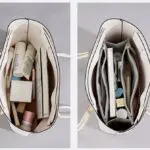 Bolso organizador Oasis blanco con compartimentos llenos de cosméticos y libros.