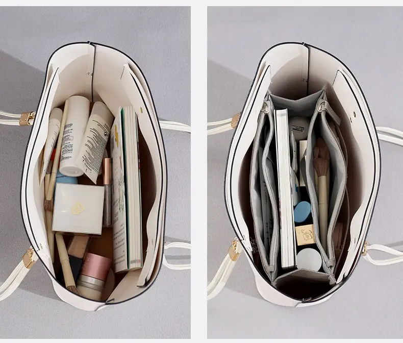 Bolso organizador Oasis blanco con compartimentos llenos de cosméticos y libros.