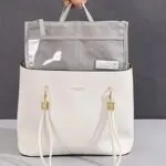 Bolso organizador Oasis blanco y gris, diseñado para mantener tus pertenencias ordenadas y accesibles.
