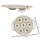 Molde de silicona para 7 donas, con medidas de 31cm x 25cm y cavidades de 6.5cm de diámetro.