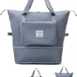 Bolso viajero plegable gris con bolsillo frontal y asas, ideal para tus escapadas.
