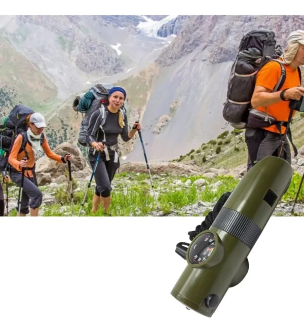 Silbato de supervivencia 7 en 1 con brújula y linterna, ideal para senderismo y rescate.