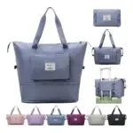 Bolso viajero gris plegable con bolsillo frontal, ideal para equipaje.