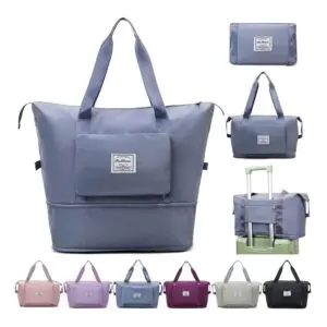 Bolso viajero gris plegable con bolsillo frontal, ideal para equipaje.