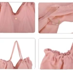 Bolso Origami rosa plegable, detallado con broches y diseño fruncido.