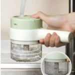Picador de verduras eléctrico para cocina en acción con agua, portátil y fácil de usar.