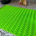 Tapete verde de silicona multiusos para cocina, diseño ondulado con rejillas.