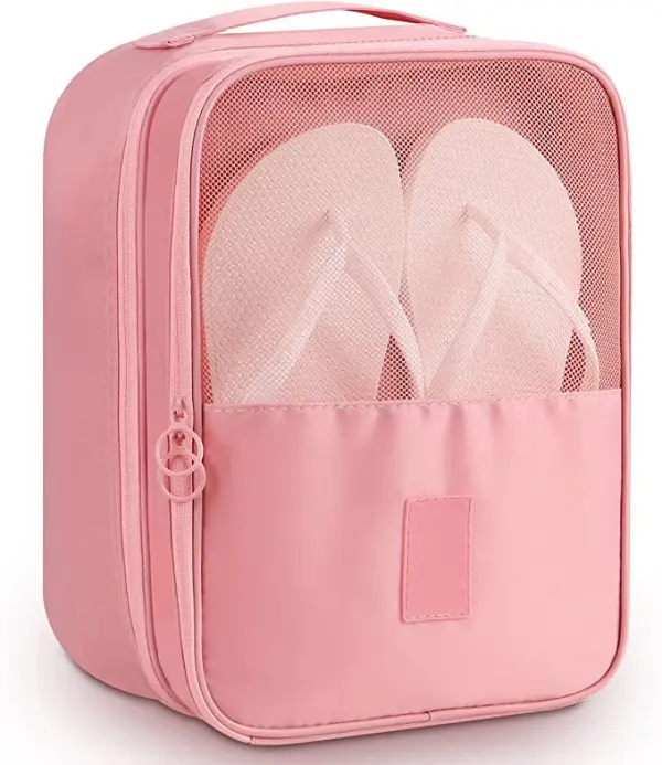 Bolso de viaje rosa con compartimento de malla para zapatos y ropa.