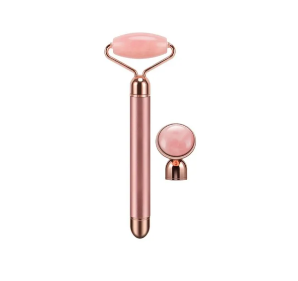 Masajeador facial Flawless Contorn antiedad con rodillo de cuarzo rosa vibratorio y accesorio.