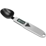 Cuchara gramera digital con pantalla y botones para pesar ingredientes con precisión.