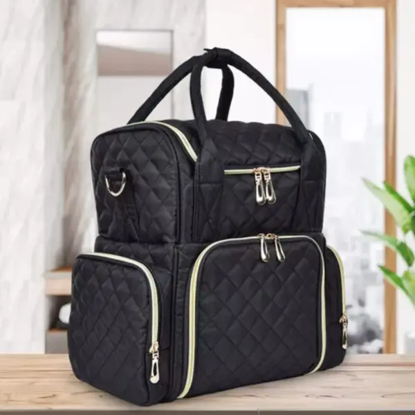 Bolso organizador de uñas negro acolchado con múltiples compartimentos y cremalleras doradas.