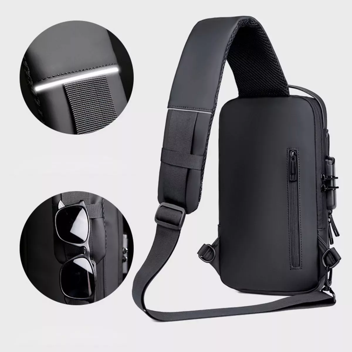 Bolso canguro antirrobo negro con bolsillo para gafas y detalles reflectantes.