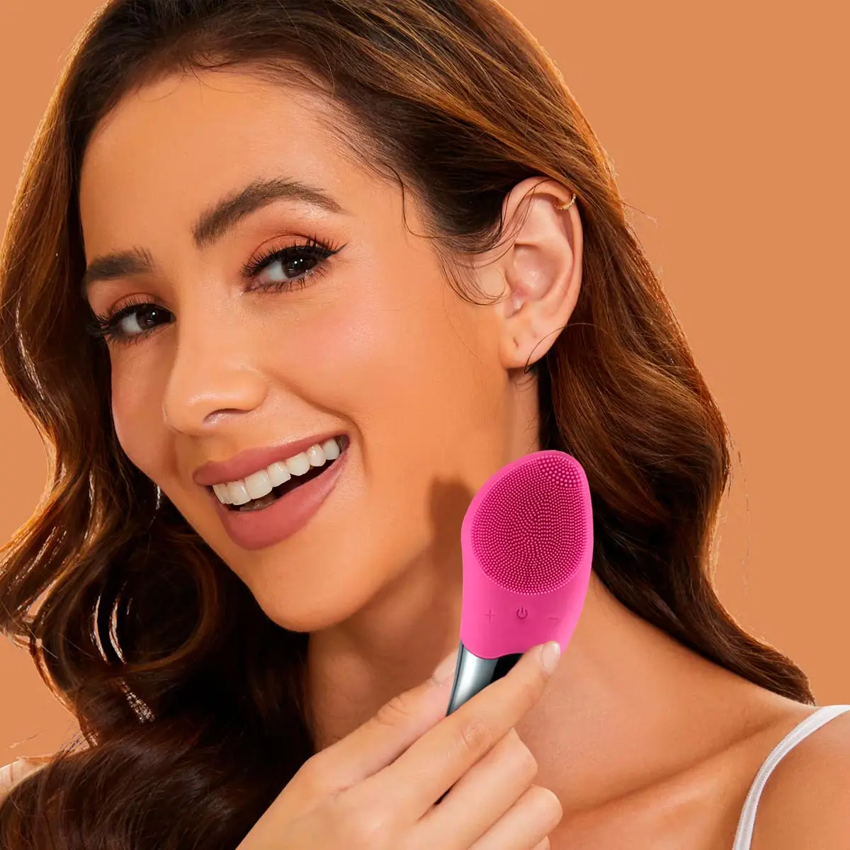 Masajeador facial limpiador rosa para una piel radiante.