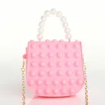 Bolso pop it rosa para niña con asa de perlas y cadena dorada, diseño divertido y moderno.