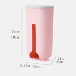 Dispensador plástico rosa para bolsas con adhesivo, 26cm de alto, 12cm de ancho.