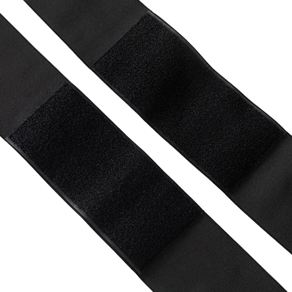 Cinturilla de compresión negra con velcro ajustable para soporte lumbar y abdominal.