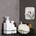 Estante organizador negro para pared con dispensador de jabón y esponja de baño.