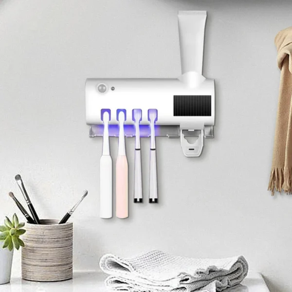 Soporte esterilizador UV para cepillos de dientes, con dispensador de pasta dental automático.