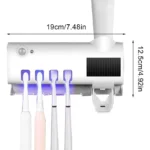 Soporte esterilizador UV para cepillos de dientes, con dispensador de pasta dental integrado.