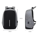 Mochila morral antirrobo gris con puerto USB, 45x30x14cm, ideal para viajes.