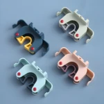 Set x2 soportes adhesivos para escobas y traperos, color azul oscuro, verde, azul claro y rosa.