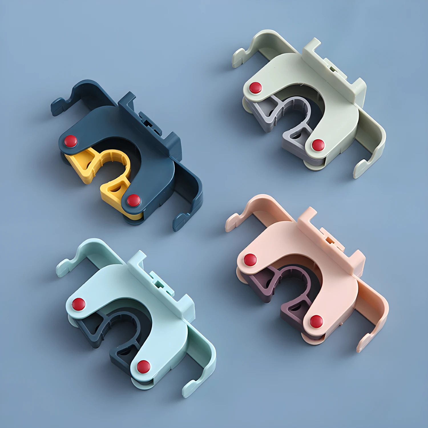 Set x2 soportes adhesivos para escobas y traperos, color azul oscuro, verde, azul claro y rosa.