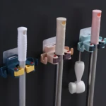 Soportes adhesivos para escobas y traperos, organizadores de pared con gancho.