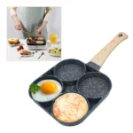Sartén antiadherente de 4 puestos con huevo frito y tortita, ideal para desayunos.